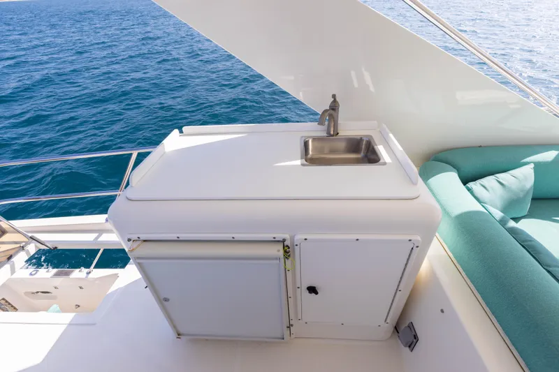 Slide: The Image of Outdoor sink and seating area on 1997 West Bay Sonship yacht deck. - 15