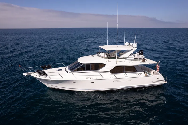 Slide: The Image of 1997 West Bay Sonship yacht cruising on open sea under clear skies. - 2