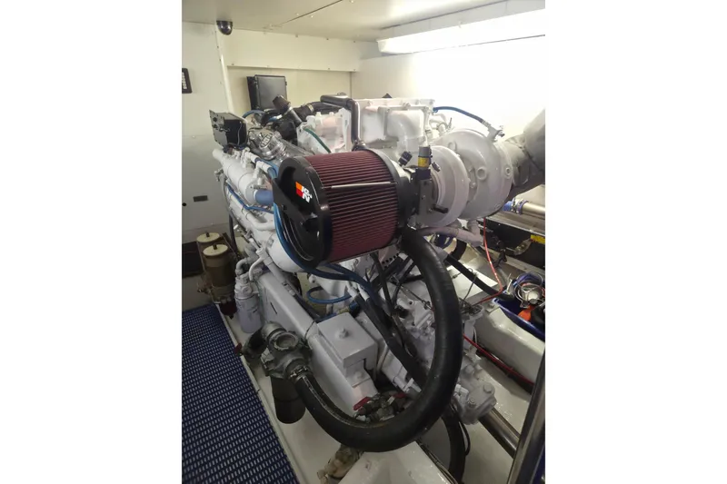 Slide: The Image of Engine room of 1997 West Bay Sonship yacht, featuring a powerful marine engine. - 23