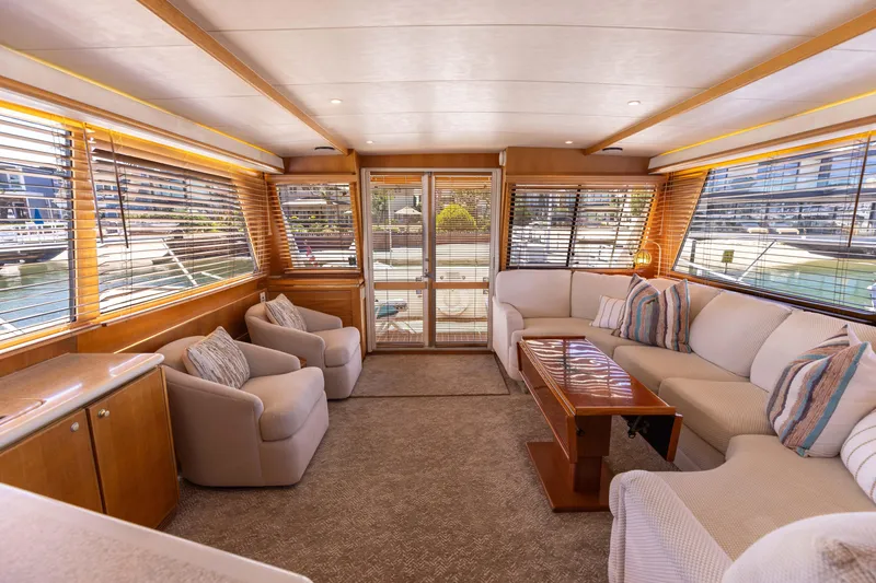Slide: The Image of Luxurious 1997 West Bay Sonship yacht interior with plush seating and elegant wood finishes. - 24