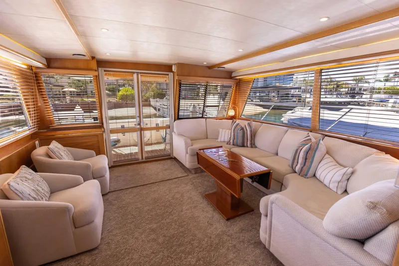 Slide: The Image of Luxurious 1997 West Bay Sonship yacht interior with plush seating and elegant wooden accents. - 25