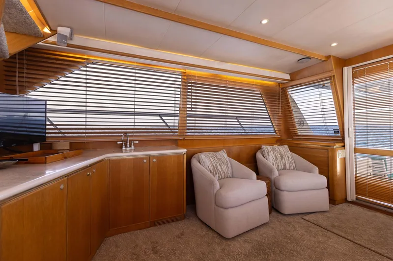 Slide: The Image of Luxurious 1997 West Bay Sonship yacht interior with plush seating and elegant wood finishes. - 27