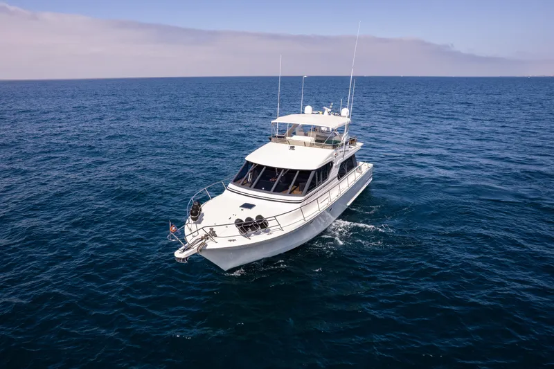 Slide: The Image of 1997 West Bay Sonship yacht cruising on open sea under clear skies. - 3