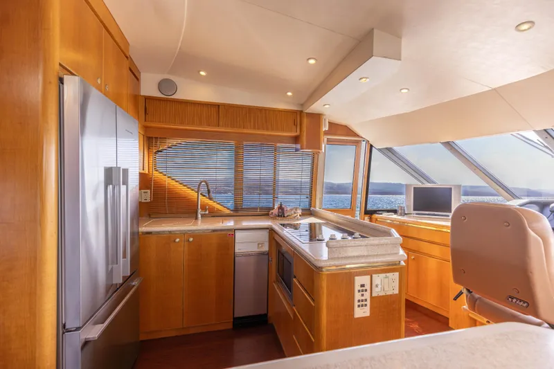 Slide: The Image of Luxurious 1997 West Bay Sonship yacht kitchen with modern appliances and ocean view. - 30