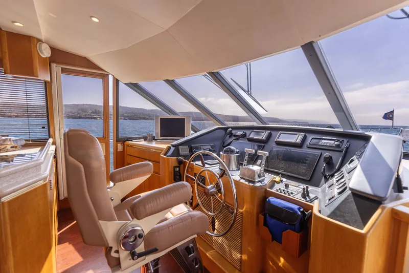Slide: The Image of Interior view of 1997 West Bay Sonship yacht helm with modern navigation equipment. - 31