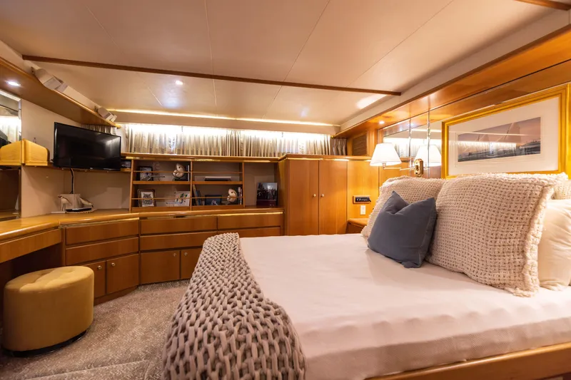 Slide: The Image of Luxurious 1997 West Bay Sonship yacht bedroom with elegant wood furnishings and cozy bedding. - 38