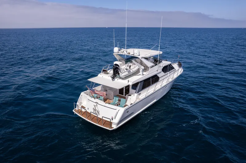 Slide: The Image of 1997 West Bay Sonship yacht cruising on open ocean waters. - 4