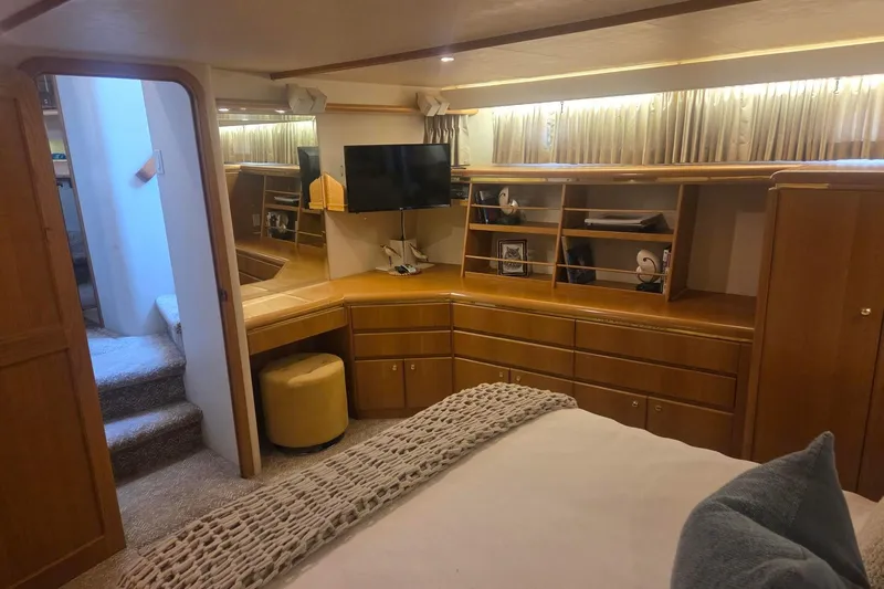 Slide: The Image of Luxurious 1997 West Bay Sonship yacht interior with wood cabinetry and modern amenities. - 40