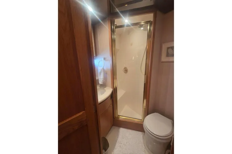 Slide: The Image of Bathroom interior of 1997 West Bay Sonship yacht with shower, sink, and toilet. - 41
