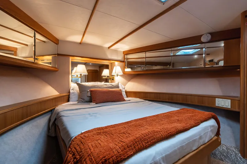 Slide: The Image of Luxurious 1997 West Bay Sonship yacht bedroom with cozy bedding and elegant lighting. - 43