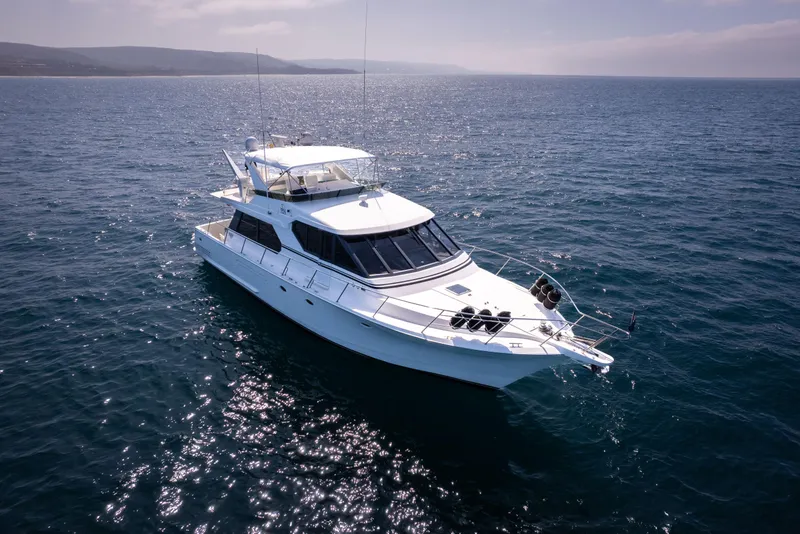 Slide: The Image of 1997 West Bay Sonship yacht cruising on open sea under clear skies. - 6