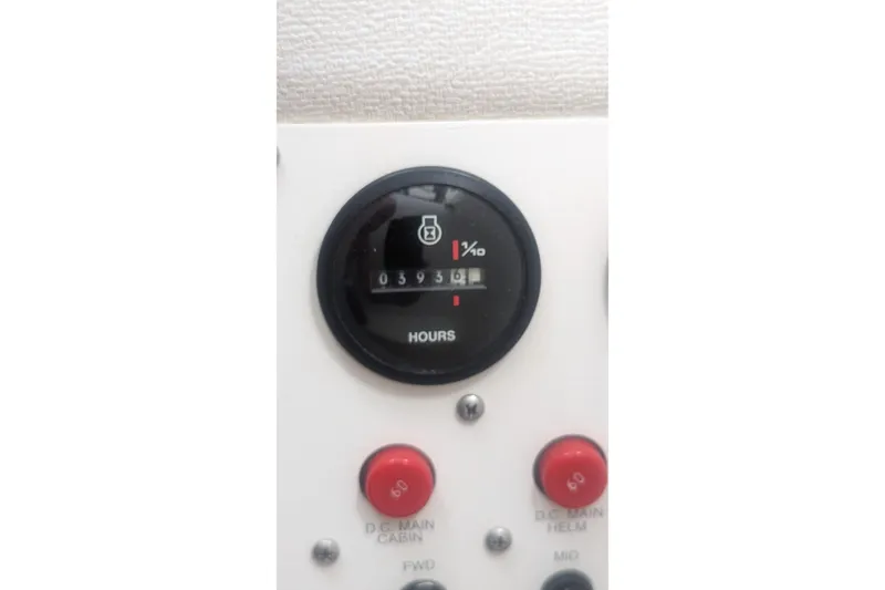 Slide: The Image of Hour meter and control panel on 1995 Wellcraft 330 Coastal boat. - 30
