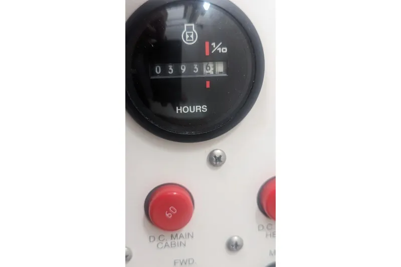 Slide: The Image of Hour meter and control panel on 1995 Wellcraft 330 Coastal boat. - 31