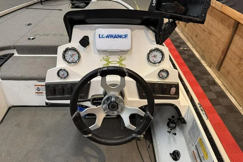 Slide: The Image of Steering console of 2026 Nitro Z18 boat with gauges and Lowrance display. - 2