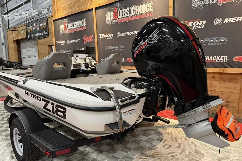Slide: The Image of 2026 Nitro Z18 boat with Mercury Pro XS engine in showroom setting. - 3