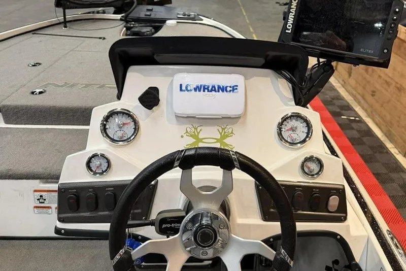 Slide: The Image of 2026 Nitro Z18 boat dashboard with Lowrance electronics and steering wheel. - 4
