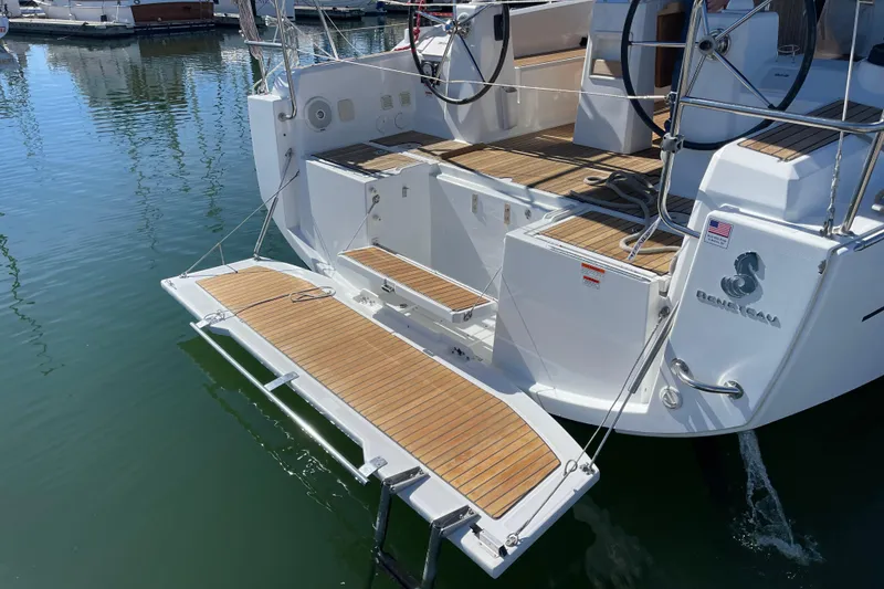 Slide: The Image of 2015 Beneteau First 235 yacht with teak deck and swim platform in marina. - 11