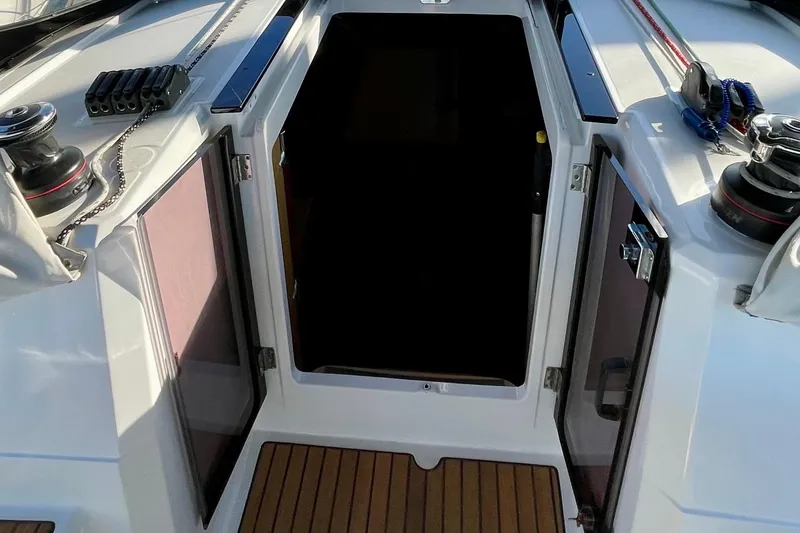 Slide: The Image of Beneteau First 235 sailboat cockpit entrance, 2015 model, with open doors and winches. - 15