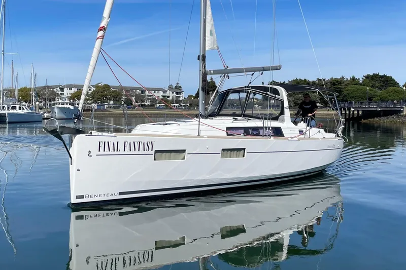 Slide: The Image of Beneteau First 235 sailboat, 2015 model, named "Final Fantasy" on calm water. - 2
