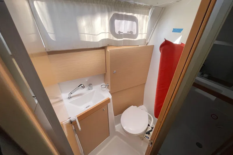 Slide: The Image of Compact bathroom in 2015 Beneteau First 235 sailboat with sink and toilet. - 25
