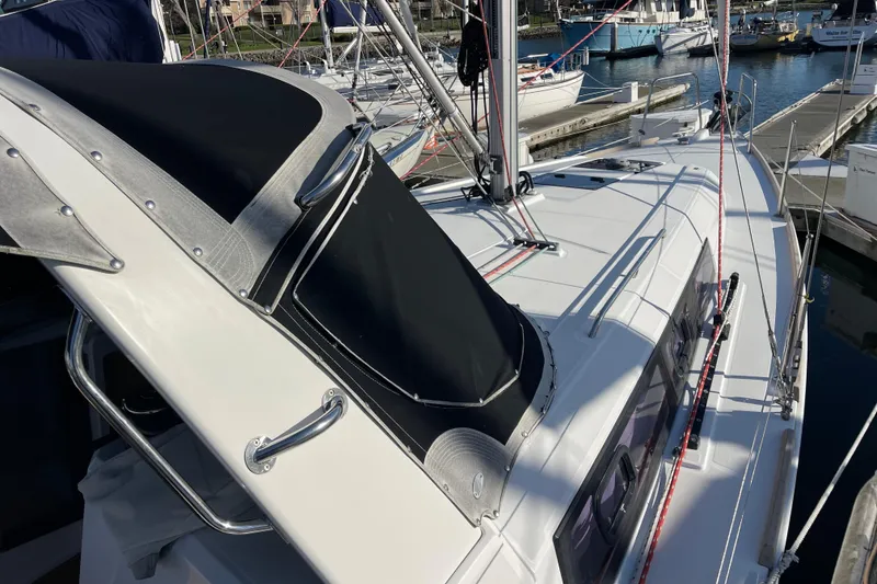 Slide: The Image of 2015 Beneteau First 235 sailboat docked at marina, showcasing sleek design and rigging. - 9