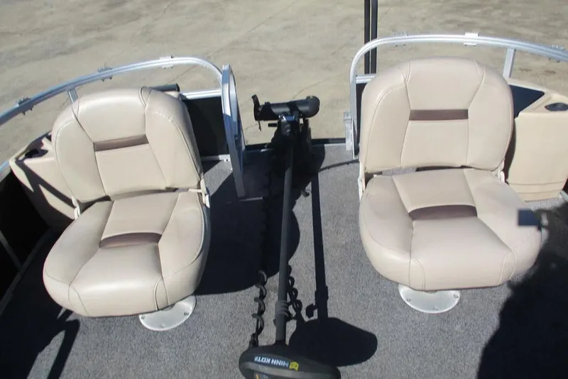 Slide: The Image of 2026 Sun Tracker Fishin' Barge 24 DLX with dual beige fishing seats. - 8