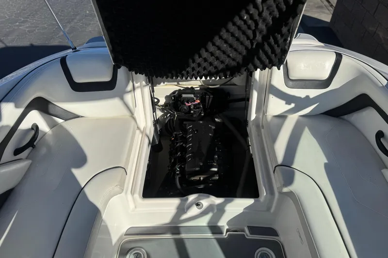 Slide: The Image of 2015 Yamaha AR190 boat engine compartment with open hatch, showcasing interior details. - 17