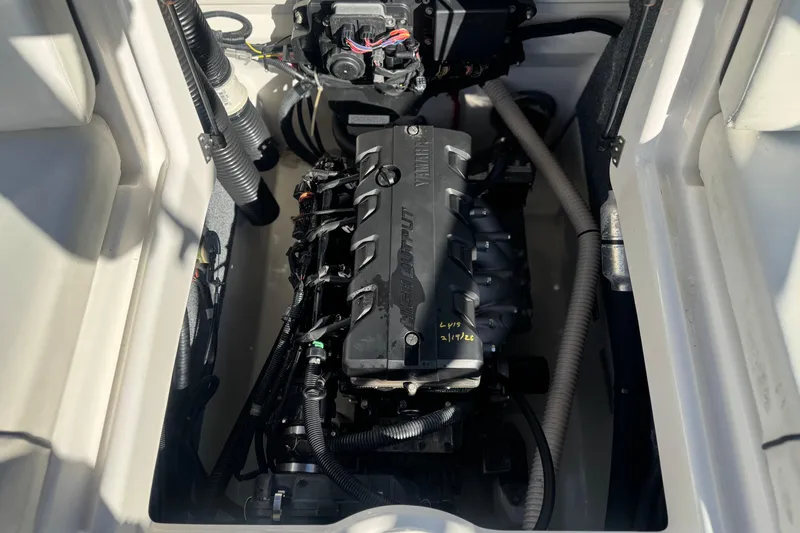 Slide: The Image of Engine compartment of a 2015 Yamaha Boats AR190, showcasing the high-output engine. - 18