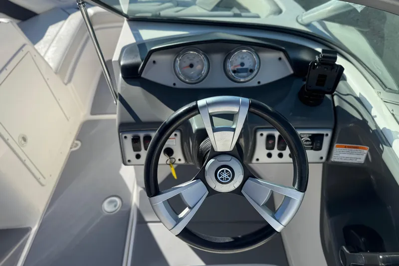 Slide: The Image of 2015 Yamaha Boats AR190 dashboard with steering wheel and instrument panel. - 25