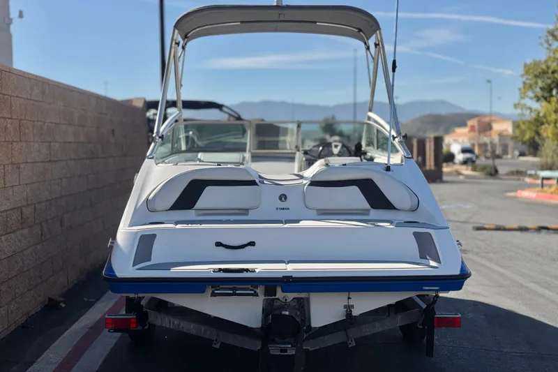 Slide: The Image of 2015 Yamaha Boats AR190 on trailer, rear view, parked outdoors. - 4