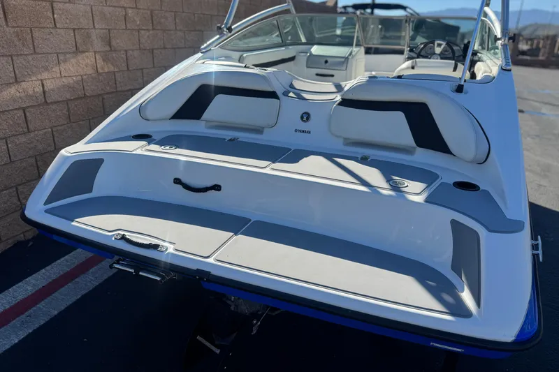 Slide: The Image of 2015 Yamaha Boats AR190, rear view, showcasing sleek design and spacious seating. - 6