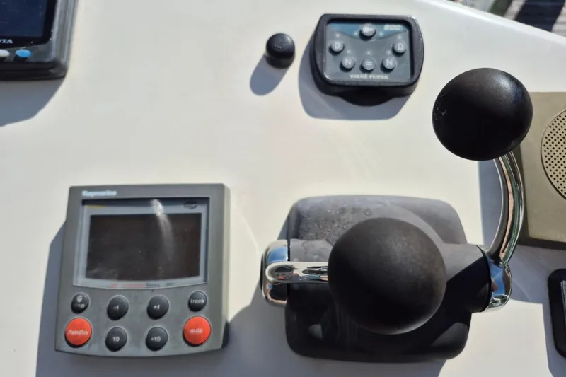 Slide: The Image of Control panel of a 2004 Riviera 4000 Offshore boat with navigation equipment. - 21