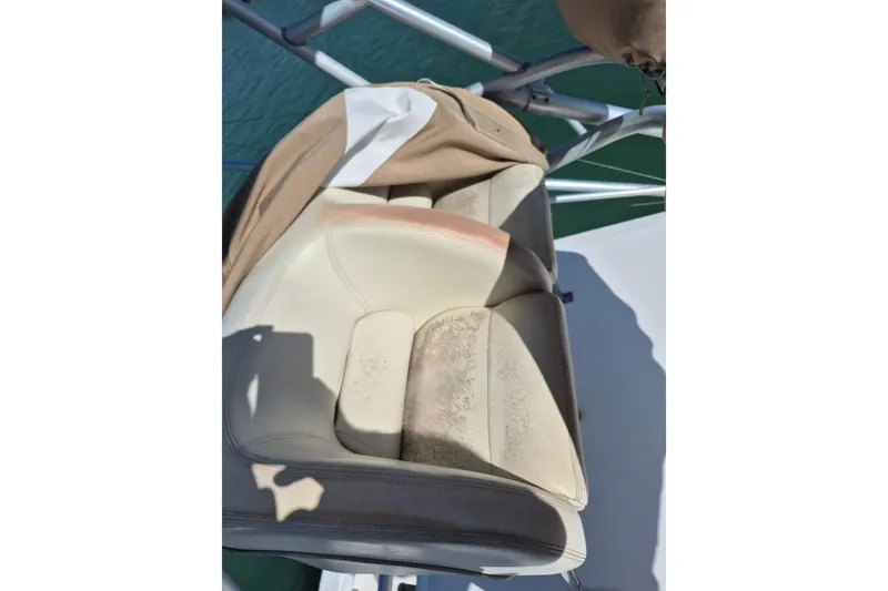 Slide: The Image of Worn seat on 2004 Riviera 4000 Offshore boat, showing signs of use and exposure. - 24