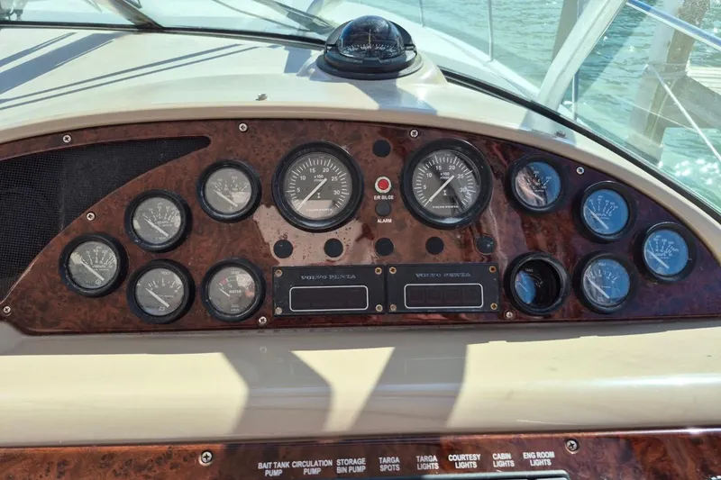 Slide: The Image of Dashboard of a 2004 Riviera 4000 Offshore boat with gauges and controls. - 30