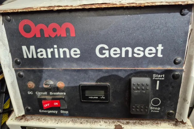Slide: The Image of Onan Marine Genset control panel on 2004 Riviera 4000 Offshore boat. - 37