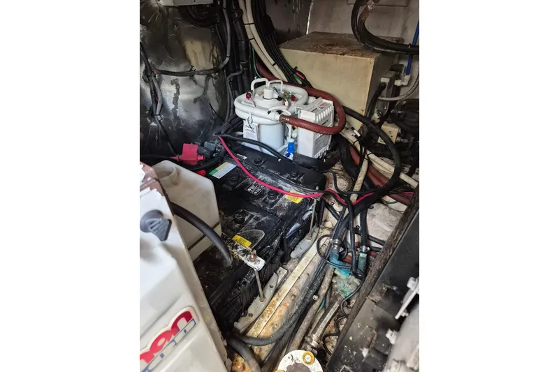Slide: The Image of Engine room of 2004 Riviera 4000 Offshore with visible wiring and components. - 39