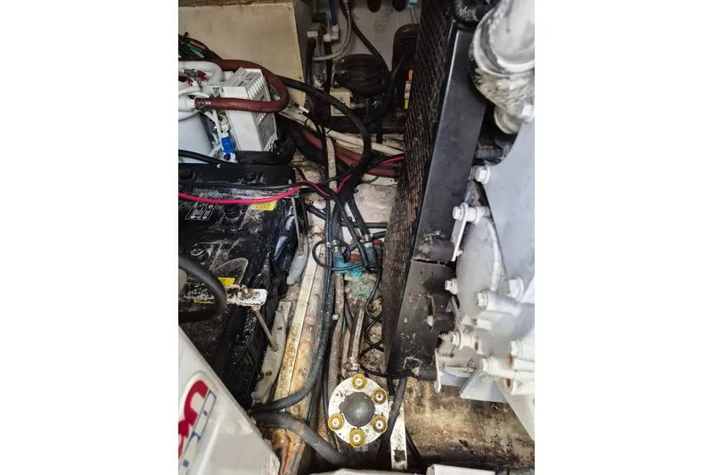 Slide: The Image of Engine compartment of a 2004 Riviera 4000 Offshore boat, showing cables and components. - 40