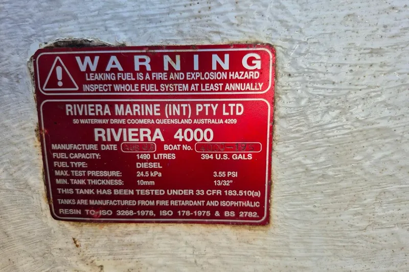 Slide: The Image of Warning label on a 2004 Riviera 4000 Offshore boat, detailing fuel system specifications. - 48
