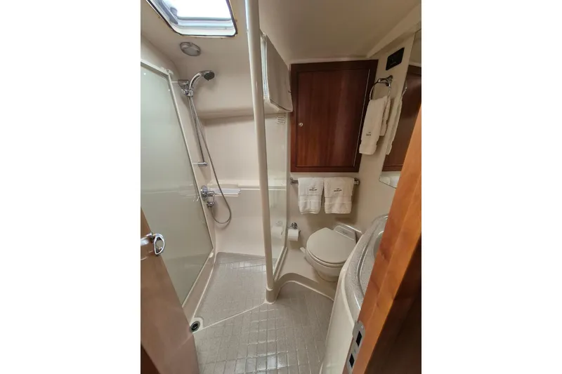 Slide: The Image of Bathroom interior of 2004 Riviera 4000 Offshore yacht with shower and toilet. - 59