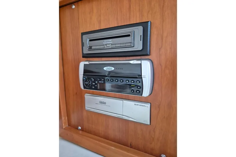 Slide: The Image of 2004 Riviera 4000 Offshore audio system with Clarion stereo and cassette player. - 63