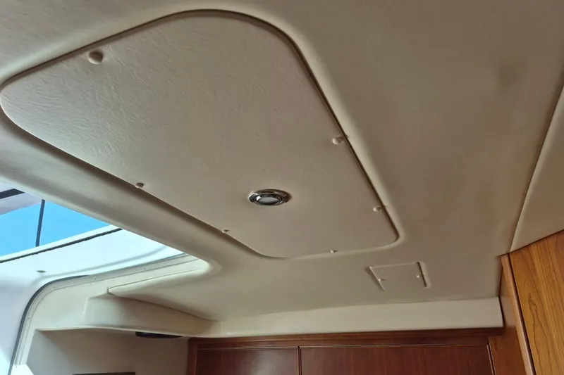 Slide: The Image of Interior ceiling of a 2004 Riviera 4000 Offshore yacht, featuring a sleek design. - 69