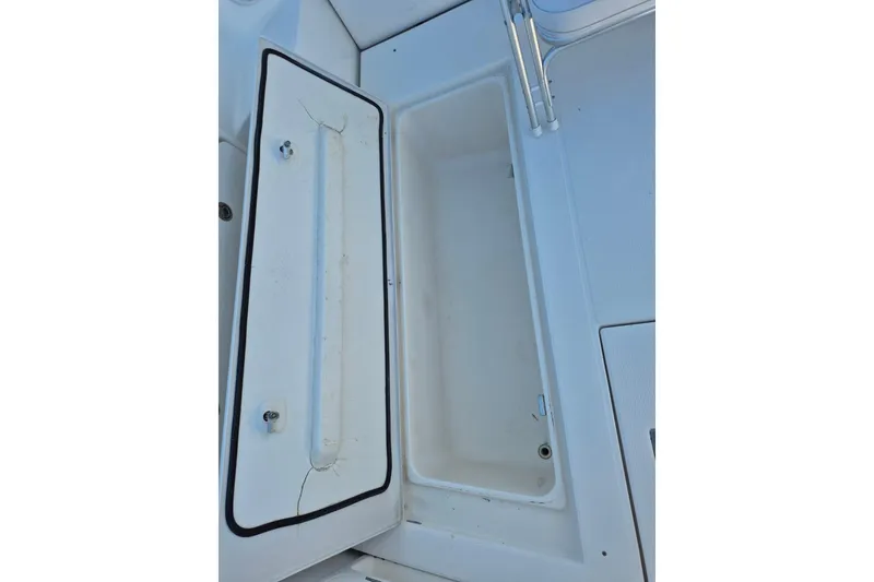 Slide: The Image of Open storage compartment on a 2004 Riviera 4000 Offshore boat. - 9