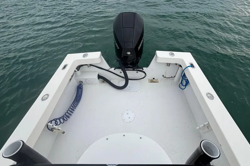 Slide: The Image of 2020 May-Craft 23 Cape Classic boat stern with outboard motor on water. - 10