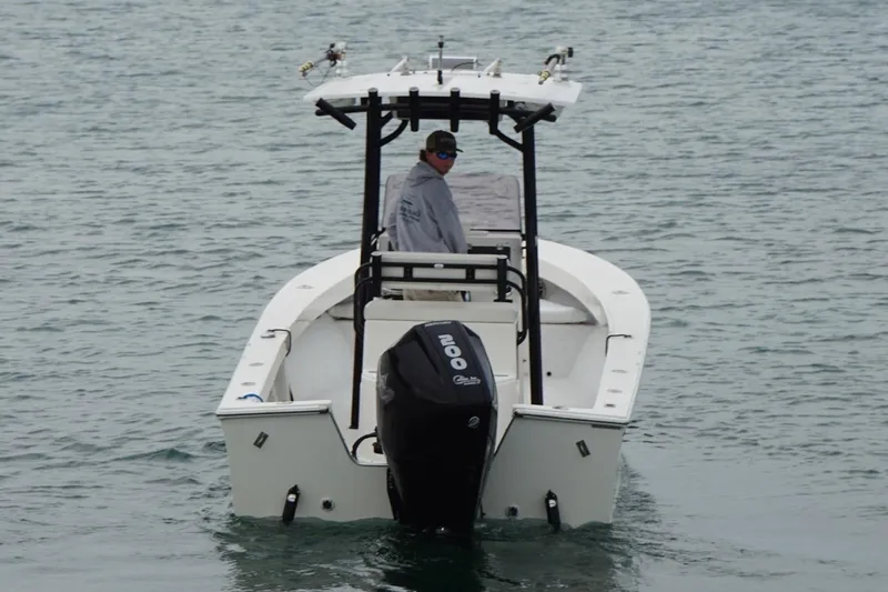 Slide: The Image of 2020 May-Craft 23 Cape Classic boat on water, rear view with outboard motor. - 3