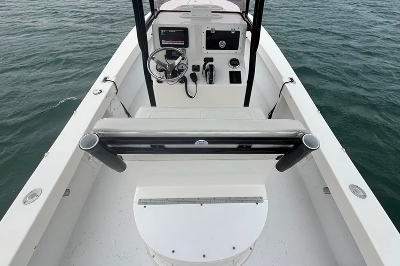 Slide: The Image of 2020 May-Craft 23 Cape Classic boat interior with steering console on open water. - 5