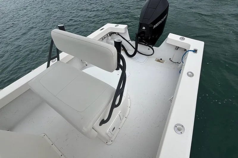 Slide: The Image of 2020 May-Craft 23 Cape Classic boat with seating and Mercury outboard engine on water. - 9