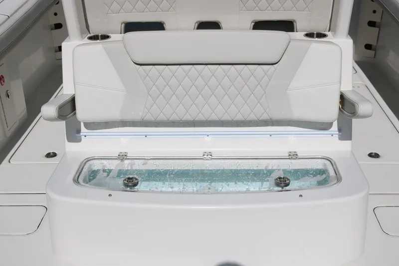 Slide: The Image of 2026 World Cat 325 CC boat with cushioned seating and built-in livewell. - 11