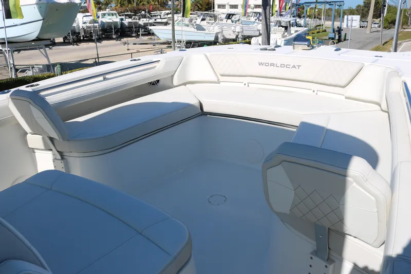 Slide: The Image of 2026 World Cat 325 CC boat interior with white seating and spacious layout. - 9