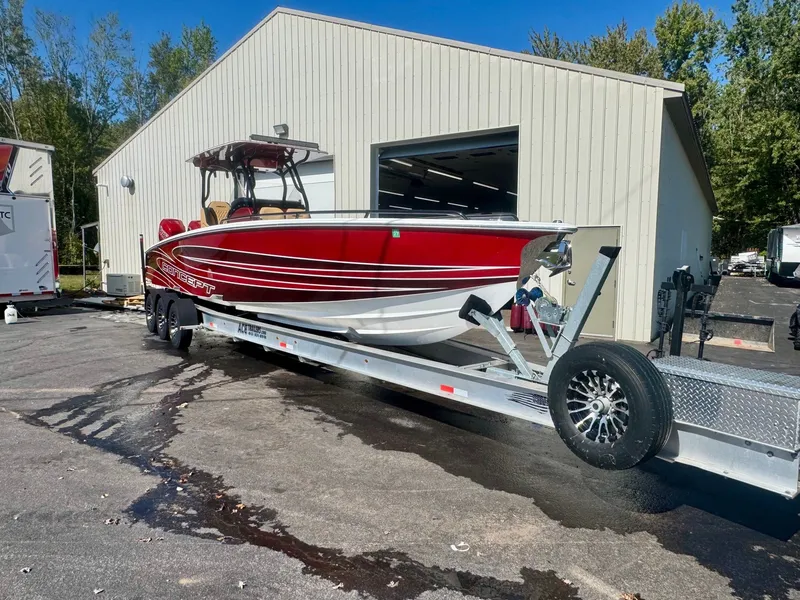 Slide: The Image of 2019 Concept 36' Open Deck boat on trailer outside garage. - 15