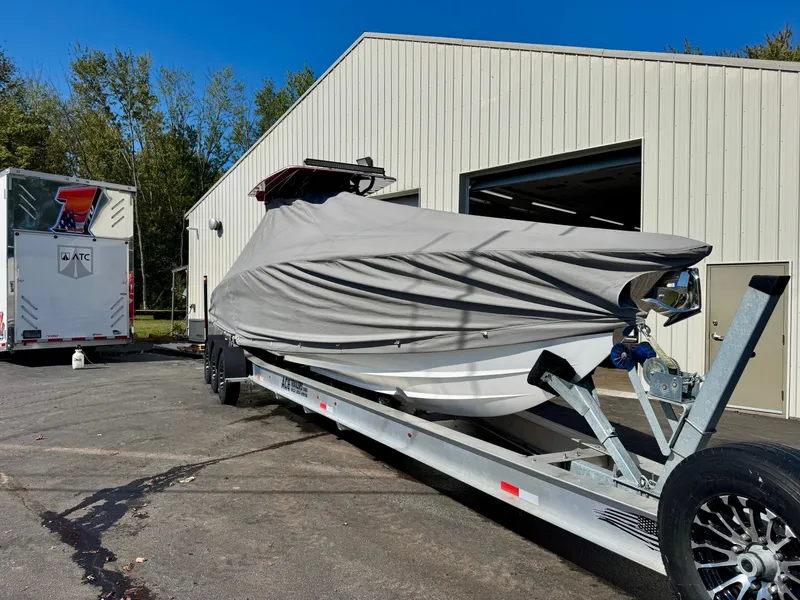 Slide: The Image of 2019 Concept 36' Open Deck boat on trailer outside warehouse. - 19